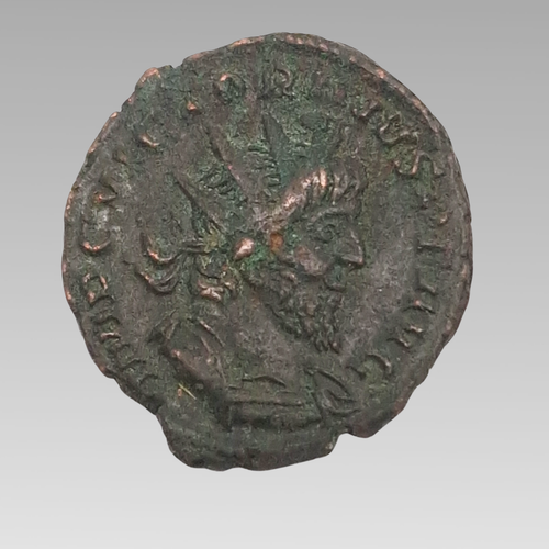 Ancient Roman 3rd century antoninianus radiate coin showing emperor portrait, approximately 19mm.