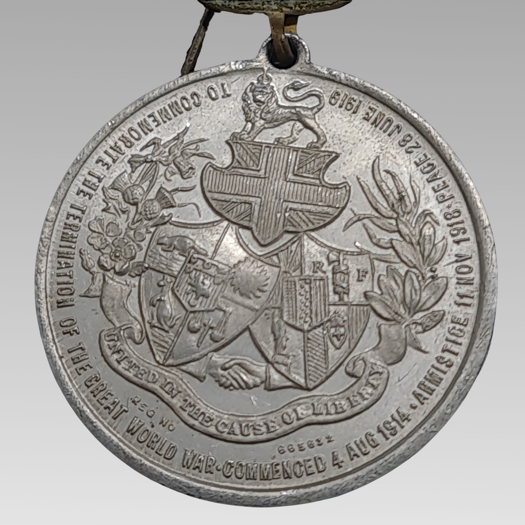 WW1 British peace medal aluminium with heraldic crest and crown top