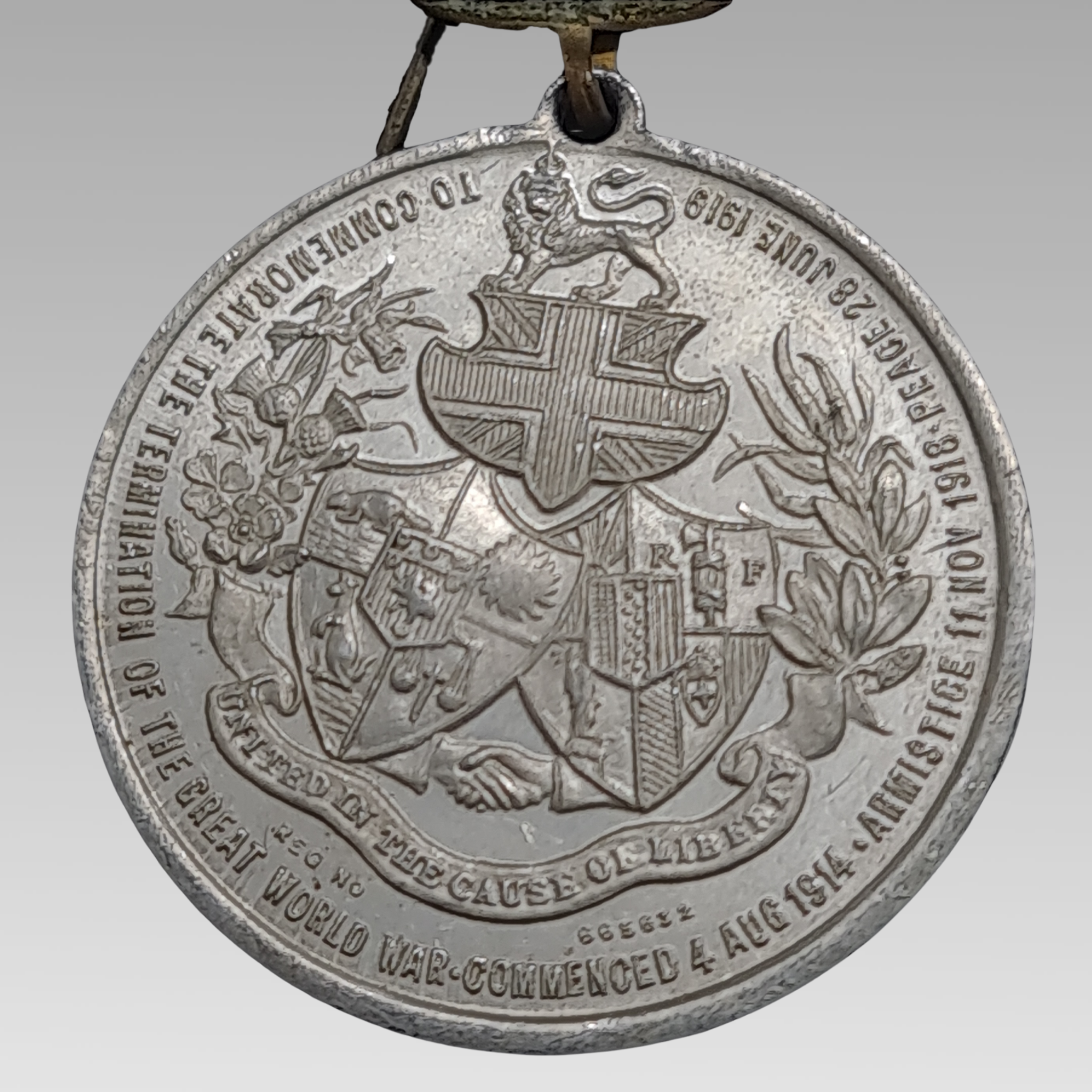 WW1 British peace medal aluminium with heraldic crest and crown top