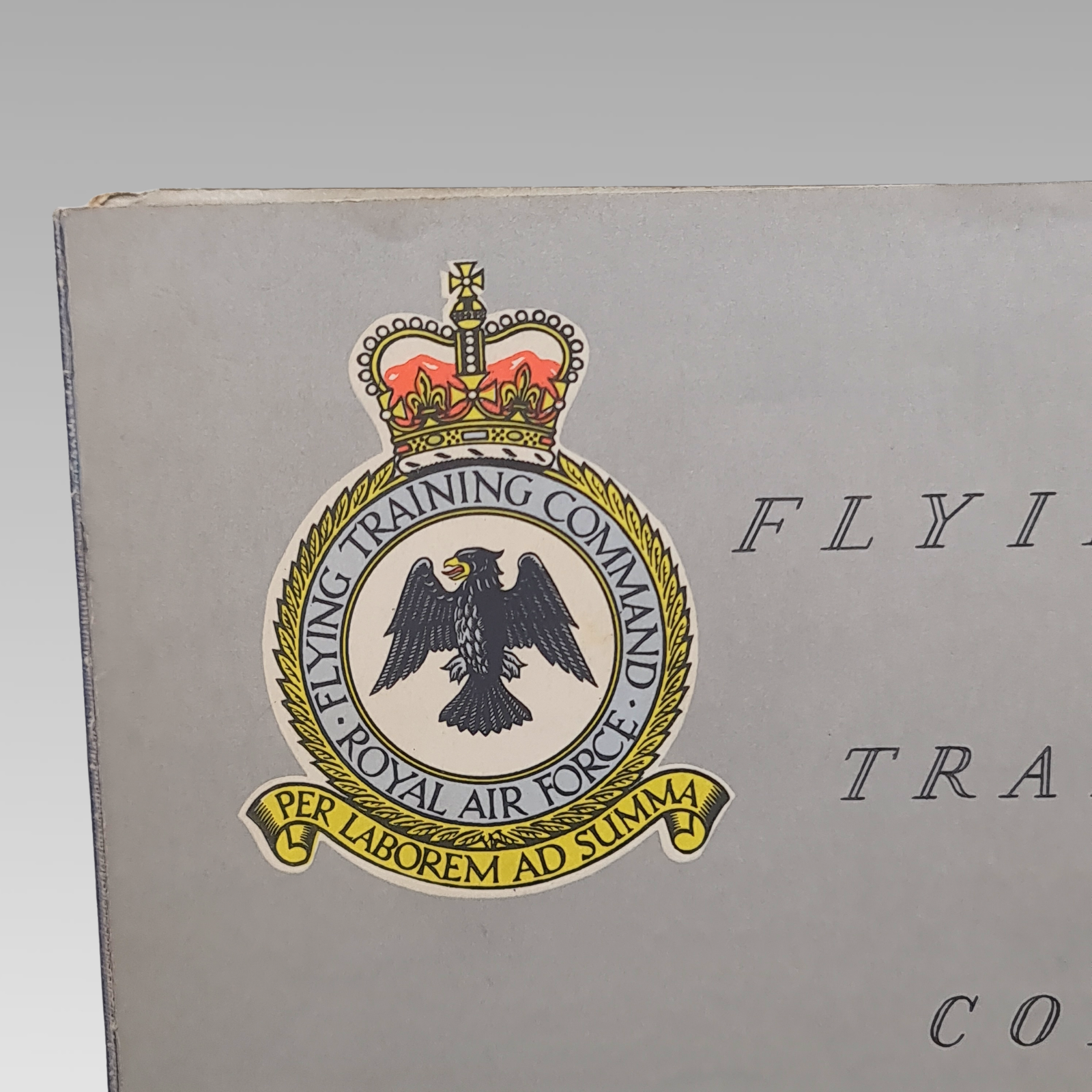 Close-up of the Royal Air Force Flying Training Command crest on the cover.