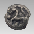 Reverse of Celtic Gaul Senones potin coin showing stylised horse and pellet design.
