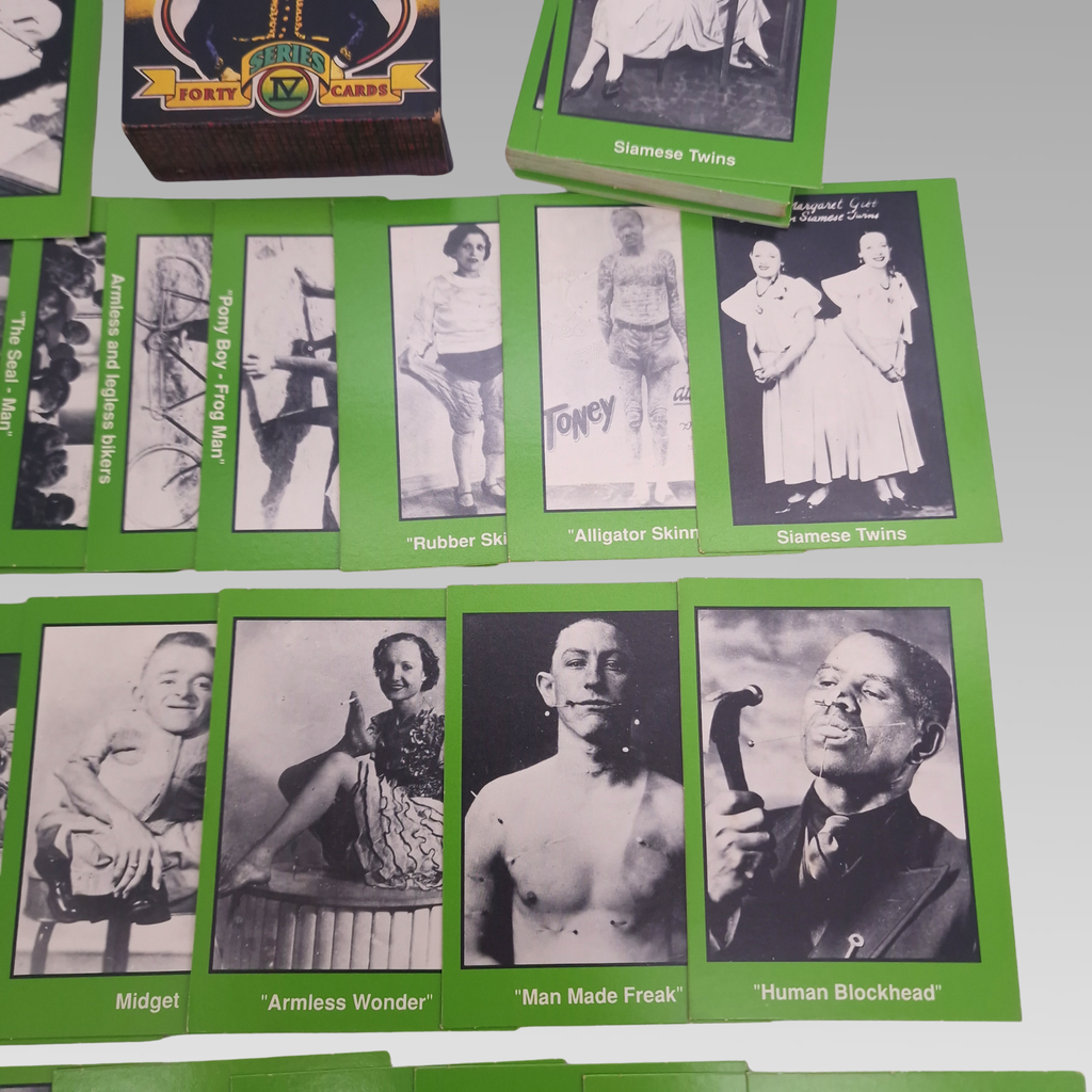 Close-up of green-bordered sideshow photographic trading cards.