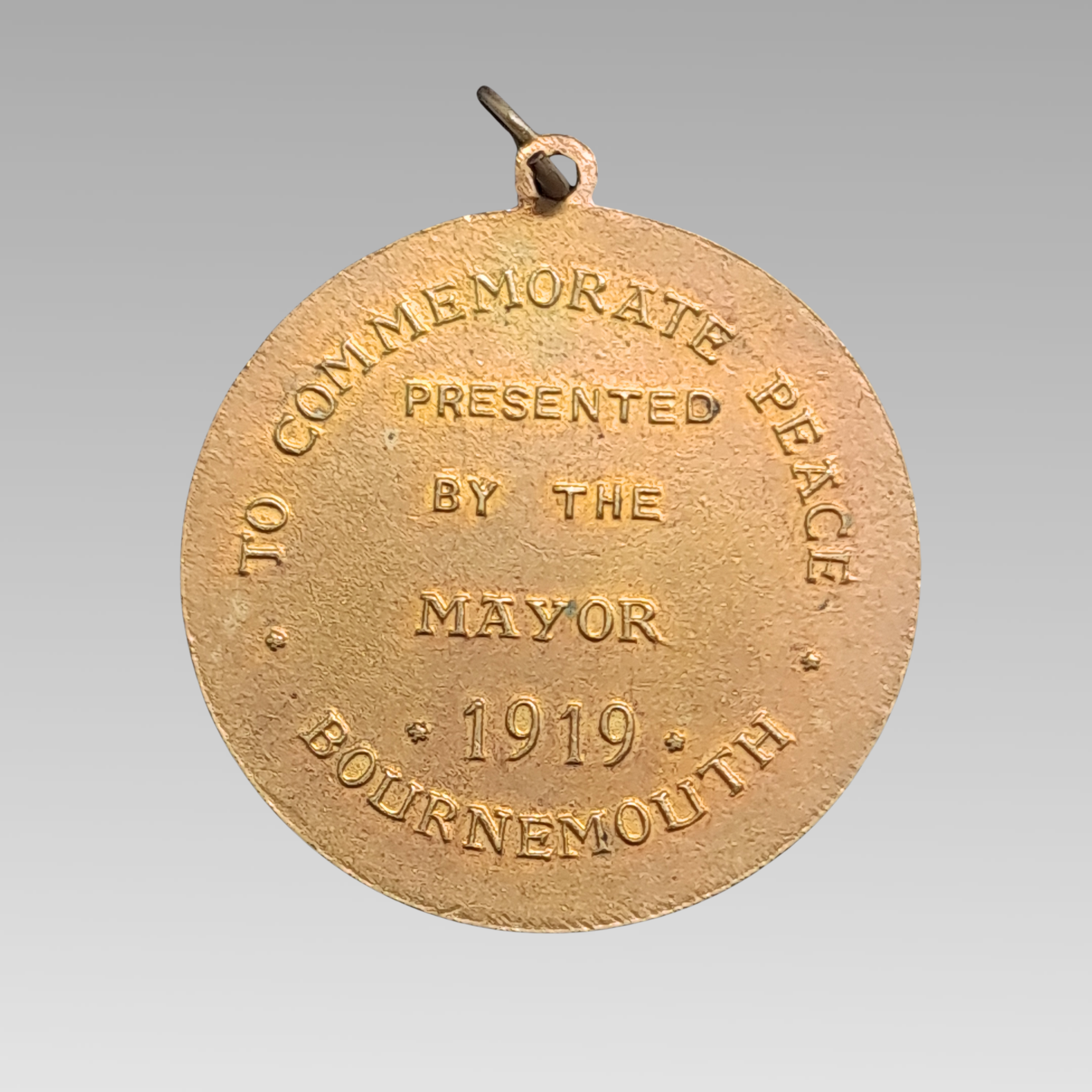 Reverse of WW1 peace medal mayor Bournemouth 1919 inscription