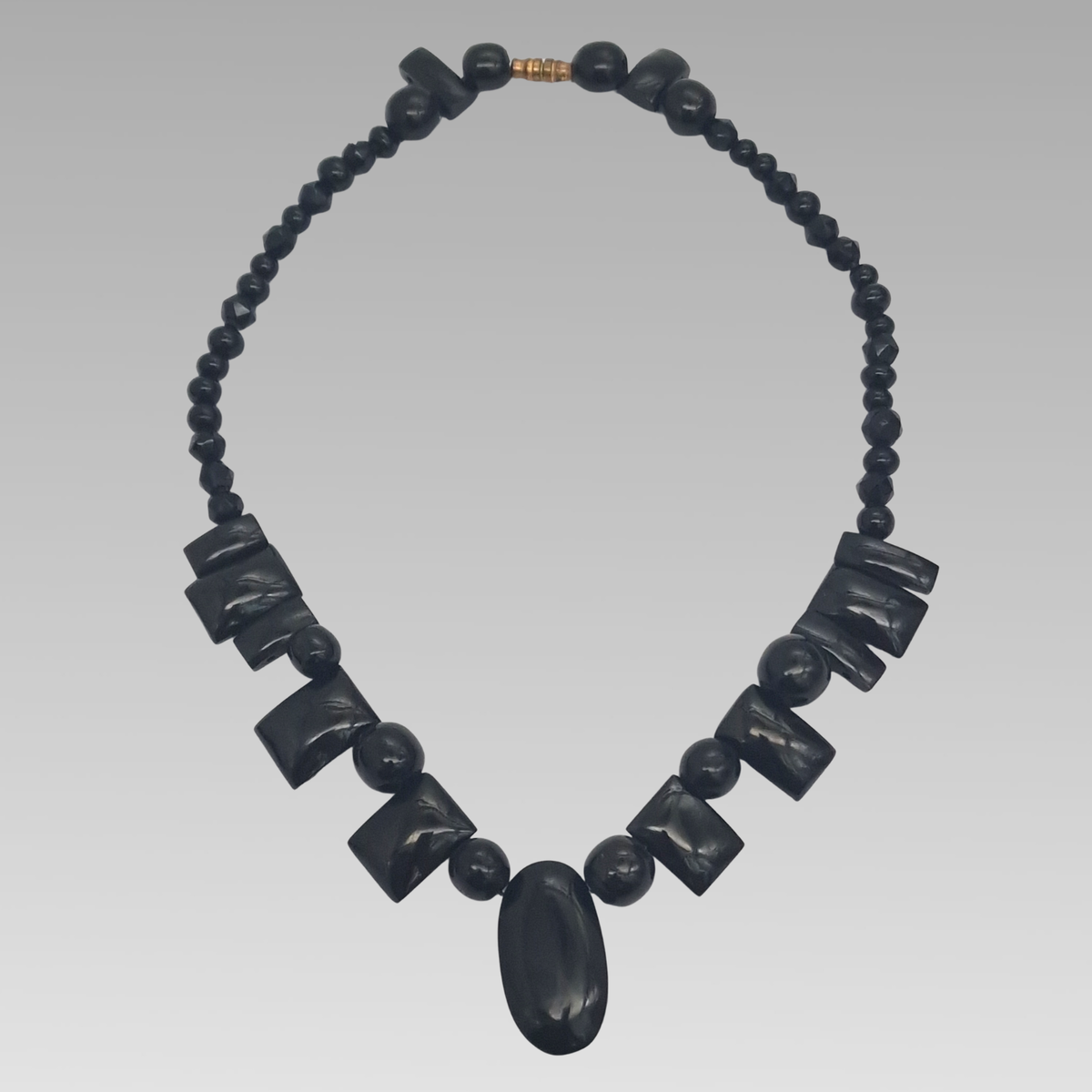 Antique Whitby jet necklace showing complete graduated Victorian design