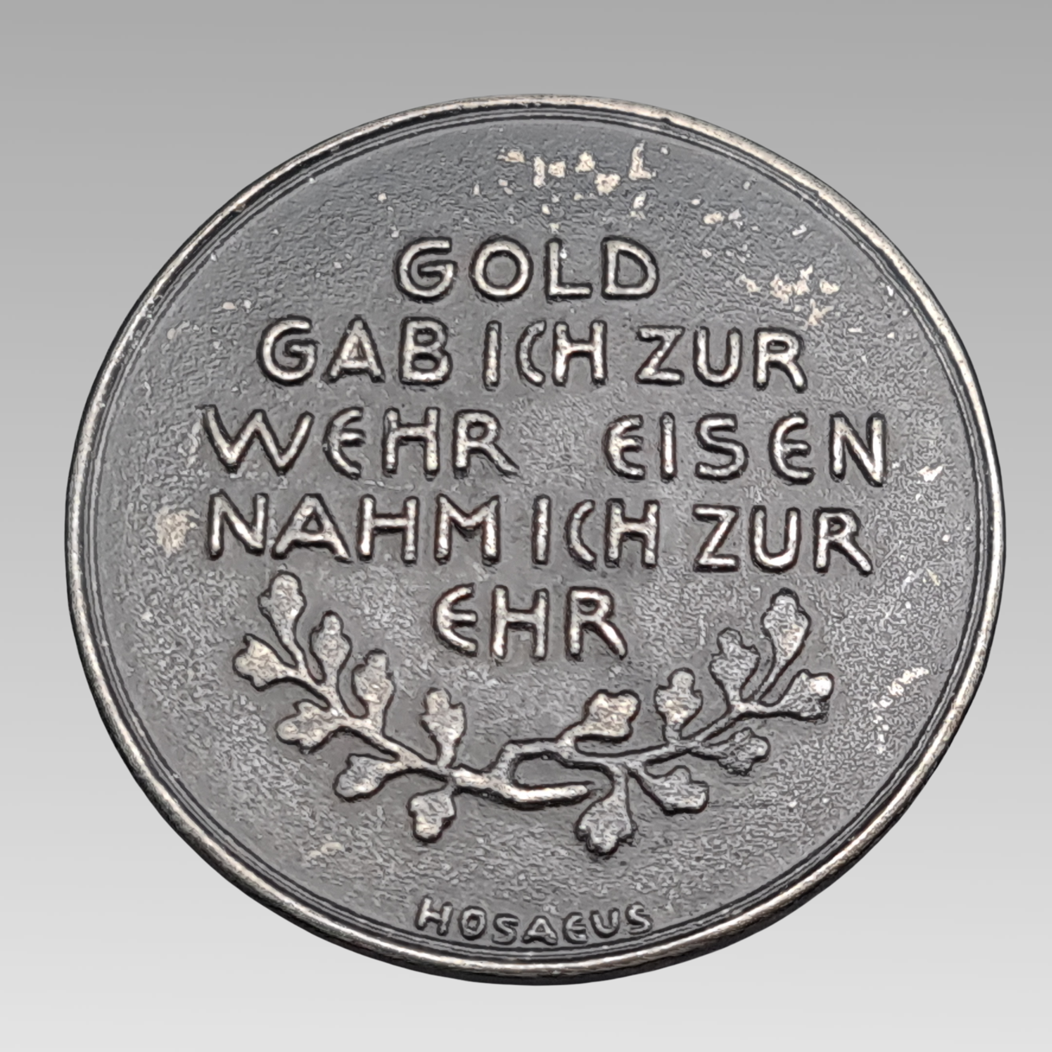 Reverse of German iron donation medal with patriotic inscription oak leaves